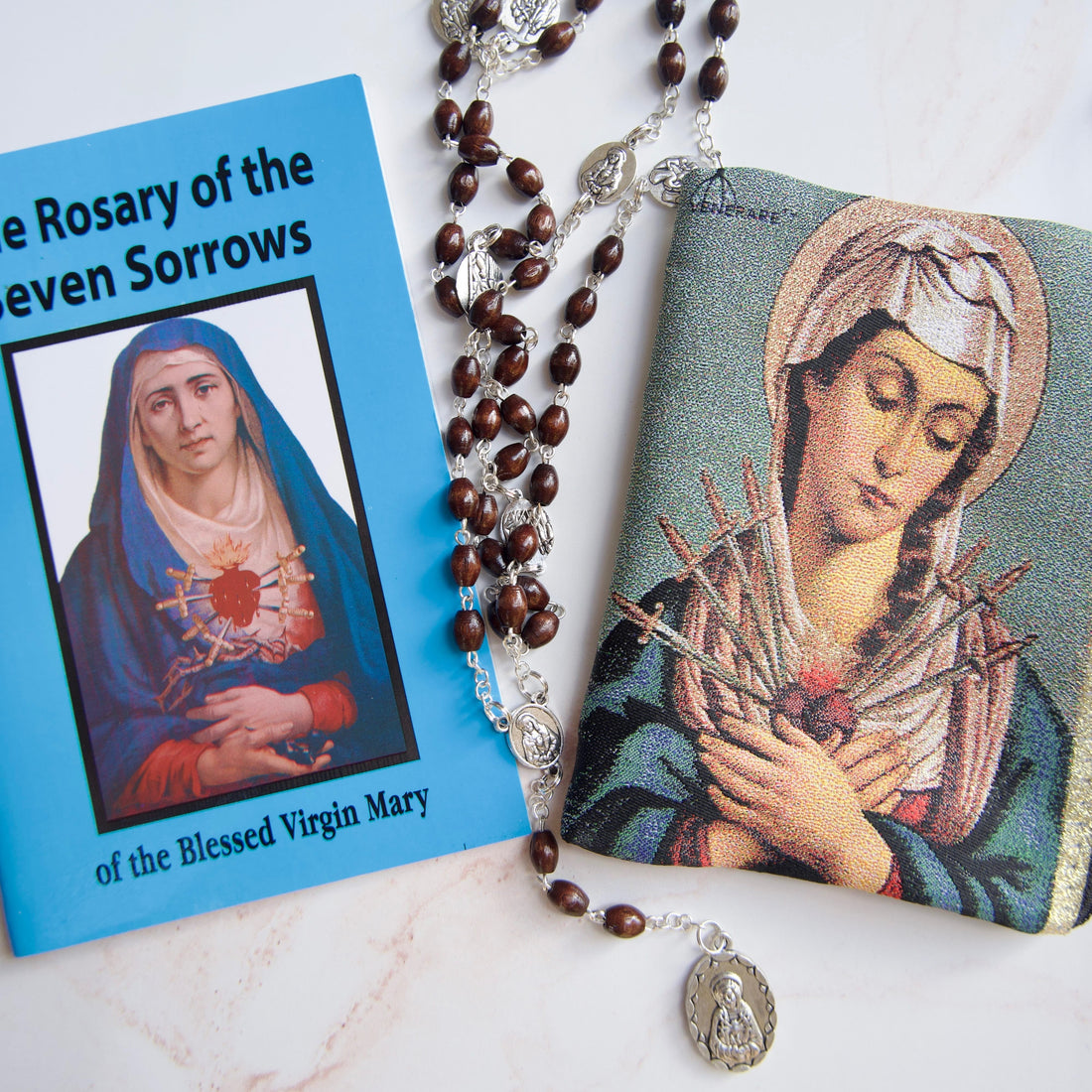 Our Lady of Sorrows Rosary Chaplet with a devotional pouch and prayer instruction booklet for praying the Seven Sorrows Chaplet.